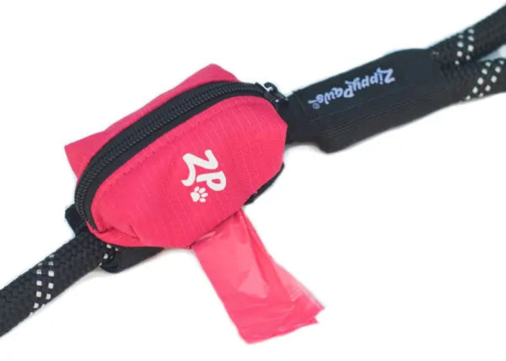 ZippyPaws Adventure Leash Waste Bag Dispenser in pink – slim leash-mounted poop bag pouch with hook-and-loop attachment and side bag opening