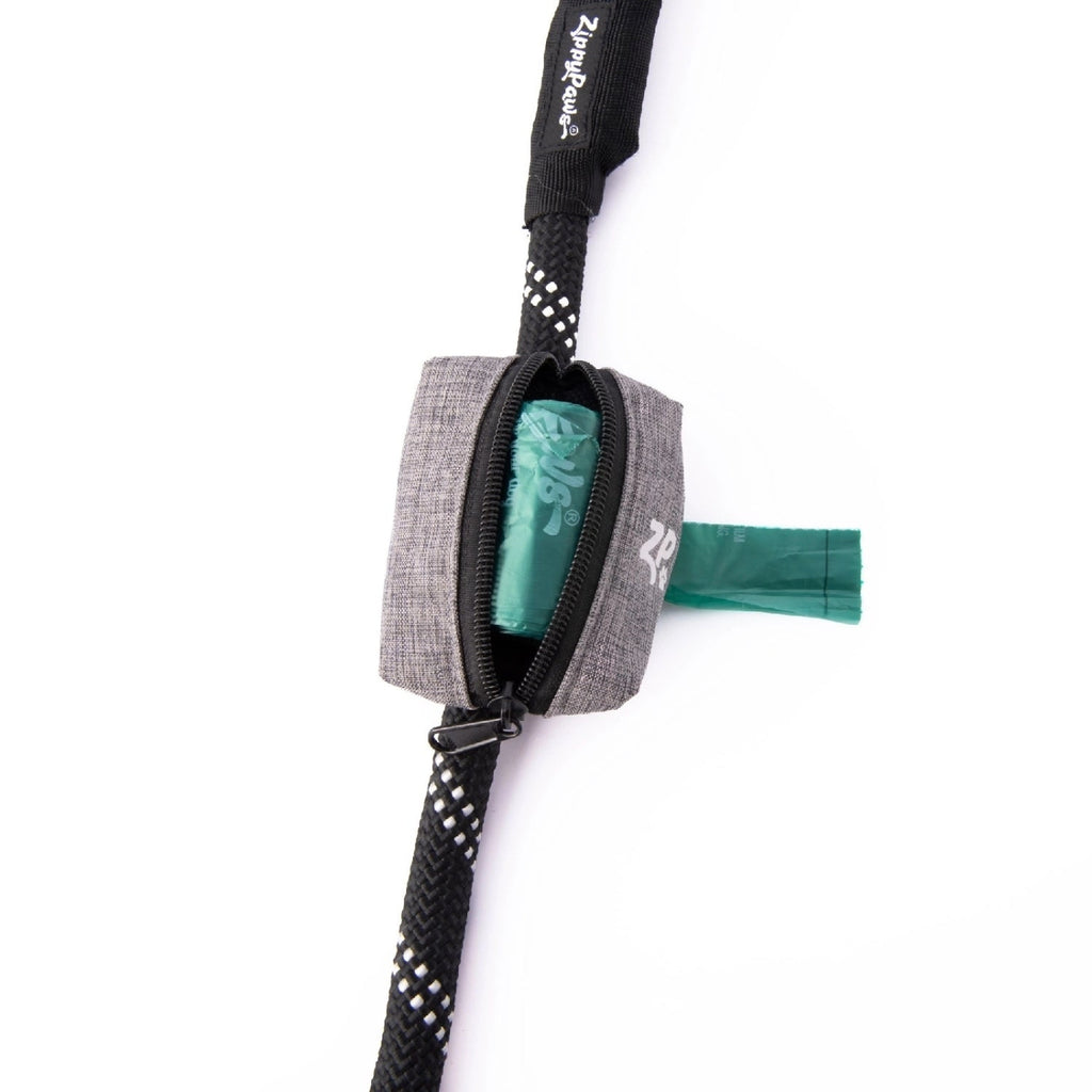 ZippyPaws Adventure grey leash waste bag dispenser attached to a dog lead with green bag roll